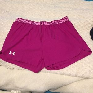 Fuschia colored Under Armour athletic shorts